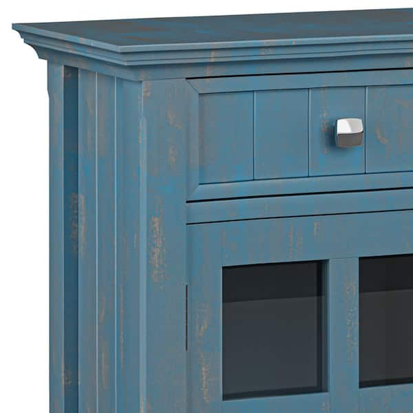 https://images.thdstatic.com/productImages/5b4a3277-aa4e-5a5f-a90a-7d9004c9a271/svn/distressed-coastal-blue-simpli-home-accent-cabinets-axcaca47-dbu-c3_600.jpg