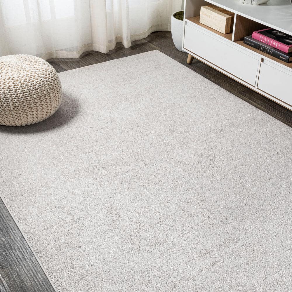 Ivory Solid Synthetic Low-Pile Rectangular Area Rug, 4' x 6'