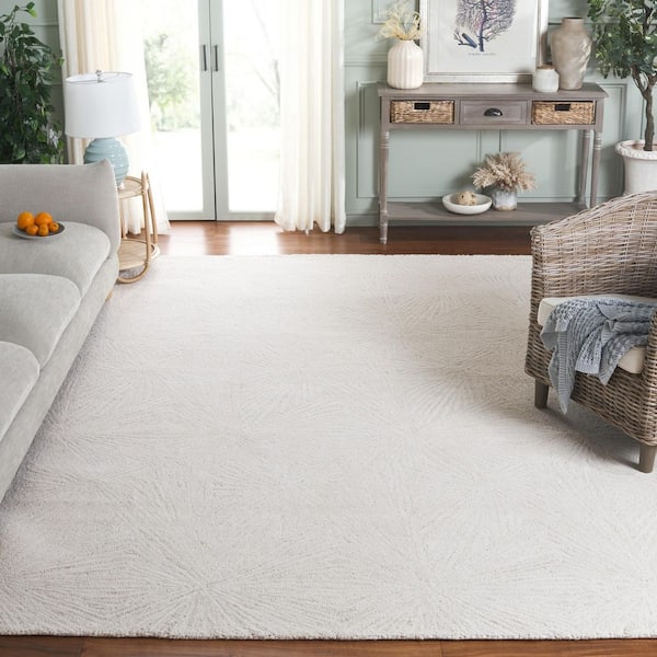 Ebony 9 ft. x 12 ft. Ivory Solid Geometric Radiant Area Rug