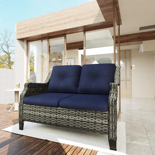 Brown Wicker Outdoor Patio Loveseat with Blue Cushions