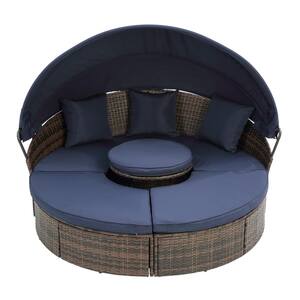 Brown Wicker Rattan Outdoor Round Lounge Day Bed with Navy Blue Cushions and Lift Coffee Table