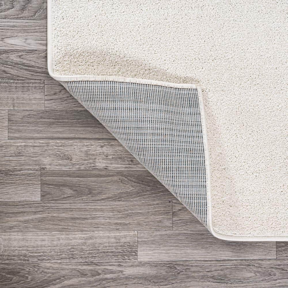 Cream Solid Synthetic Reversible 10' x 14' Area Rug
