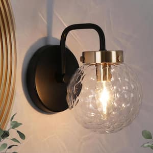 Astrid Modern 1-Light Matte Black and Plated Brass Wall Sconce Globe Vanity Light with Textured Glass Shade