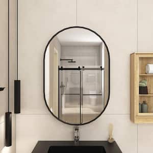 24 in. W. x 36 in. H Oval Iron Medicine Cabinet with Mirror