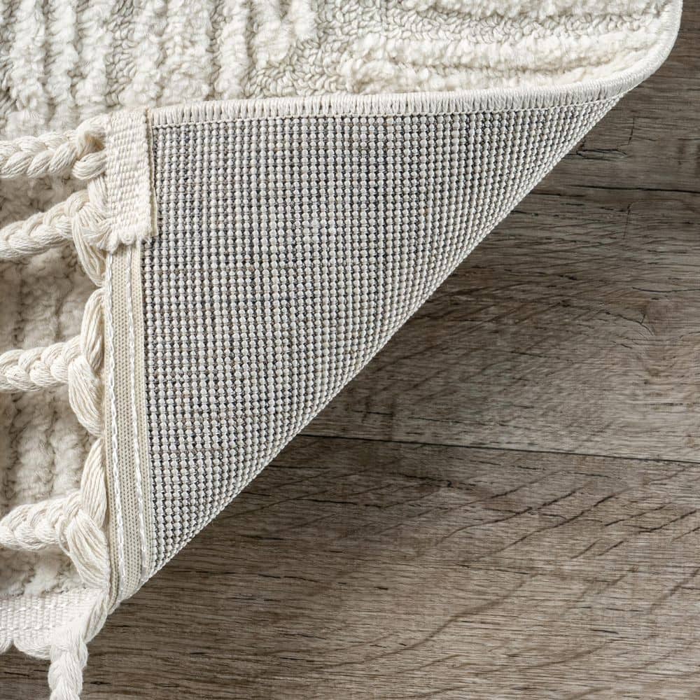 Cream Geometric Textured Synthetic Tasseled Area Rug