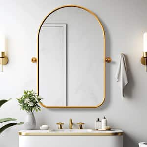 24 in. W x 35 in. H Arched Metal Framed Pivoted Bathroom Wall Vanity Mirror with Round Corners in Gold