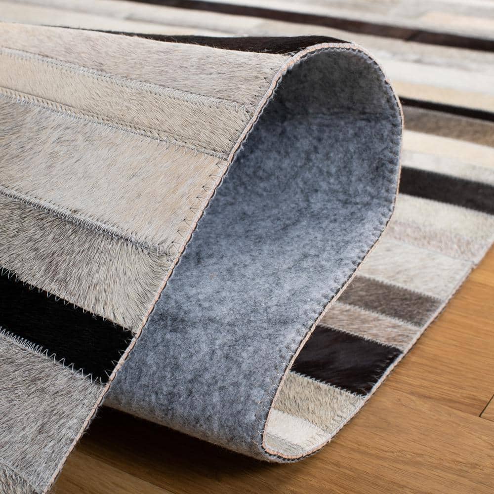 Handmade Black and Ivory Geometric Cowhide Area Rug