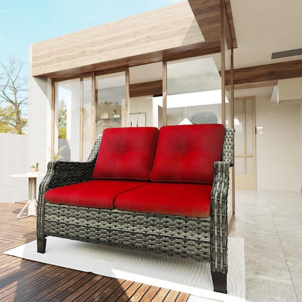 Brown Wicker Outdoor Patio Loveseat with Red Cushions