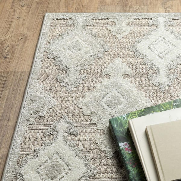 8' X 11' Beige Floral Area Rug With Fringe