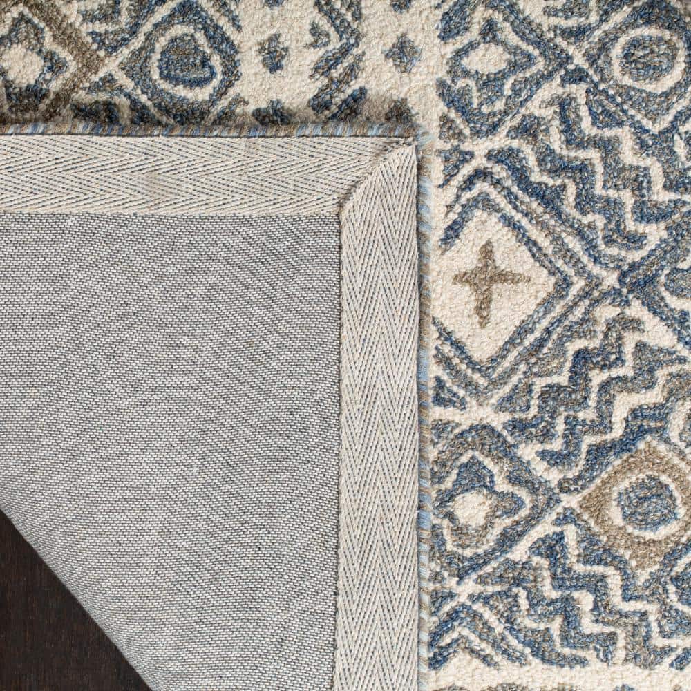 Ivory and Blue Handmade Wool Tufted Area Rug, 5' x 8'