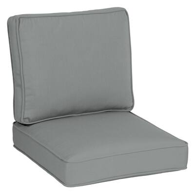 black outdoor cushions with white piping
