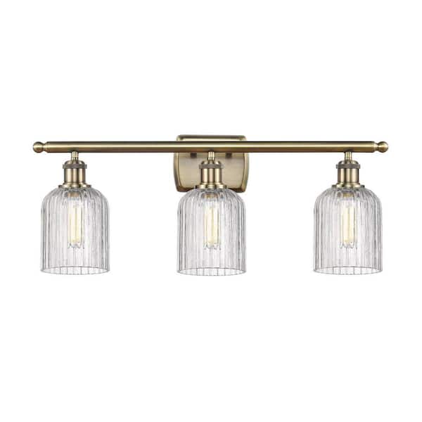 Bridal Veil 25 in. 3-Light Antique Brass Vanity Light with Glass Shade