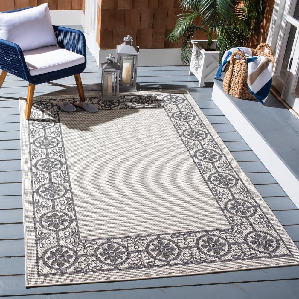 Ivory & Charcoal Geometric 8' x 10' Easy-Care Synthetic Area Rug