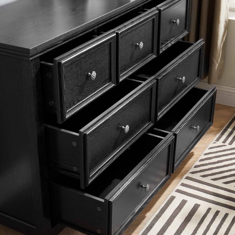 View of the open drawers on the black dresser.