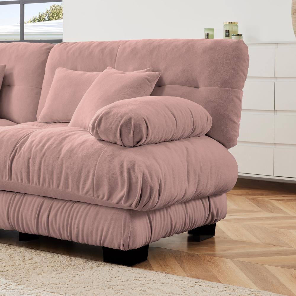 Close-up of a pink chenille modular sectional sofa.