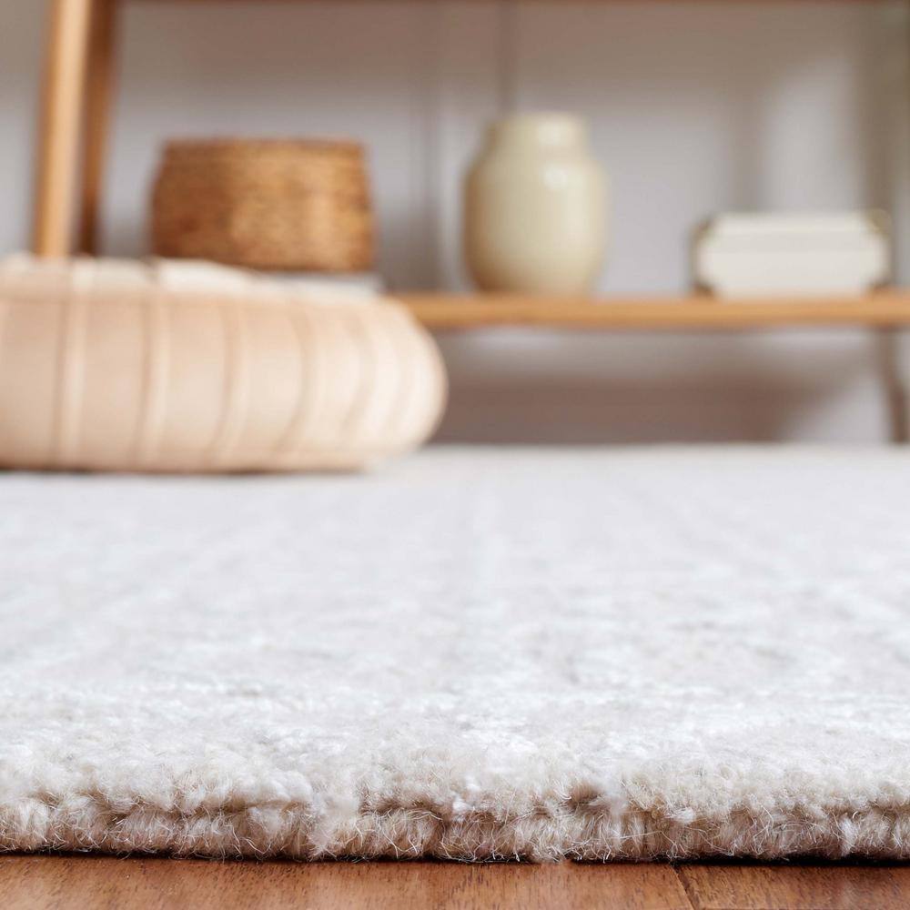 Beige and Ivory Tufted Wool and Viscose 6' x 9' Area Rug