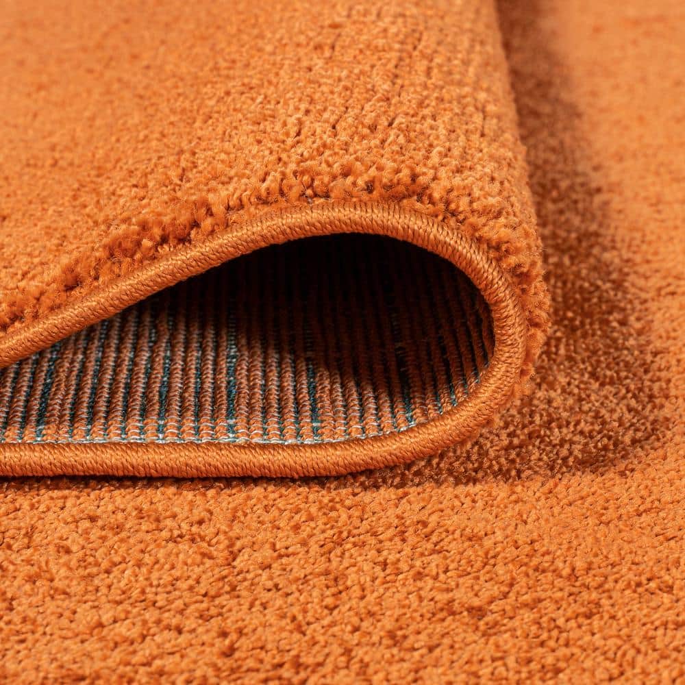 Haze Solid Orange 5'3" Square Synthetic Area Rug