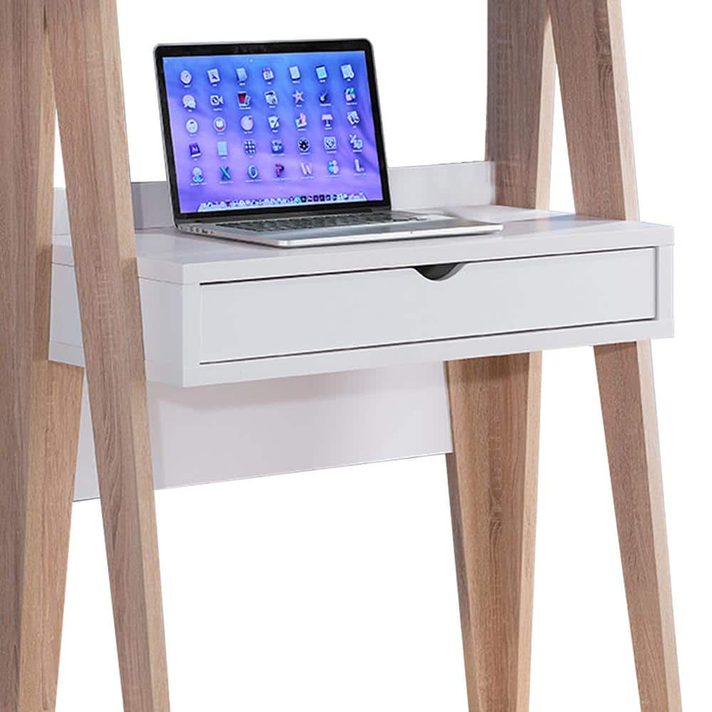 Computer desk with a laptop on the surface.