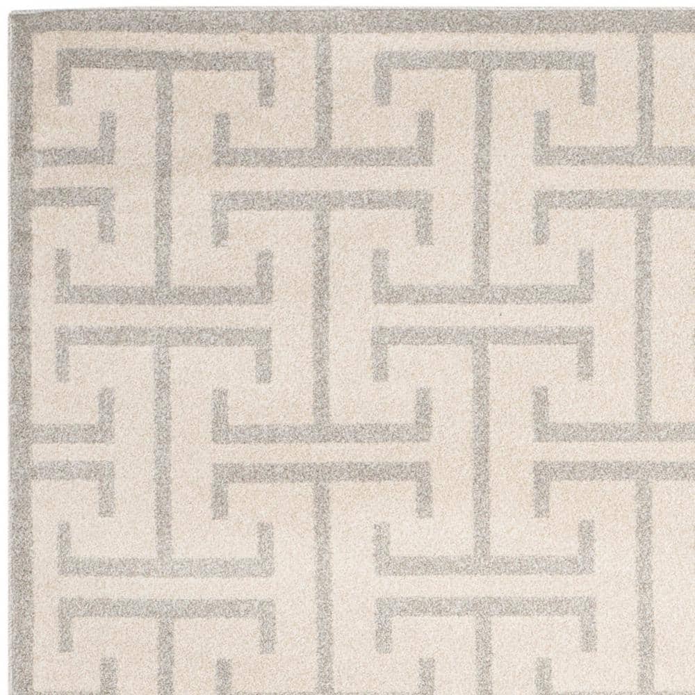 Ivory and Light Gray Rectangular 9' x 12' Synthetic Rug