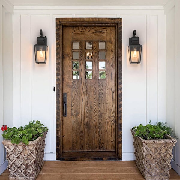 Hawaii 16 in. H Black Clear Glass Hardwired Outdoor Wall Lantern Sconce with Dusk to Dawn