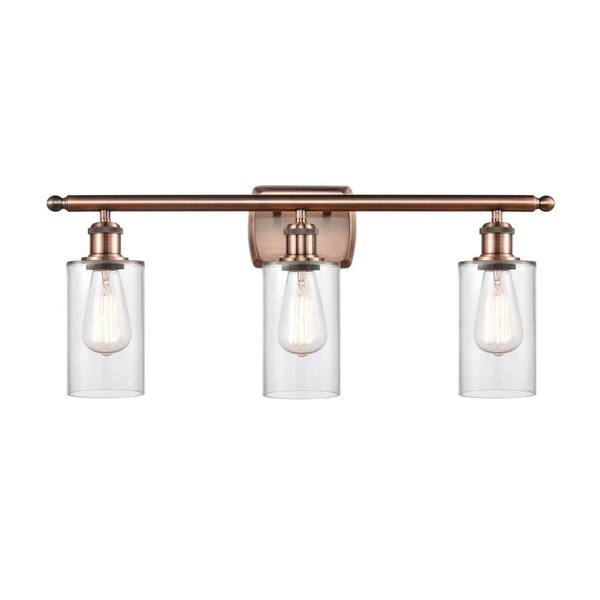 Innovations Clymer 26 in. 3-Light Antique Copper Vanity Light with Clear Glass Shade