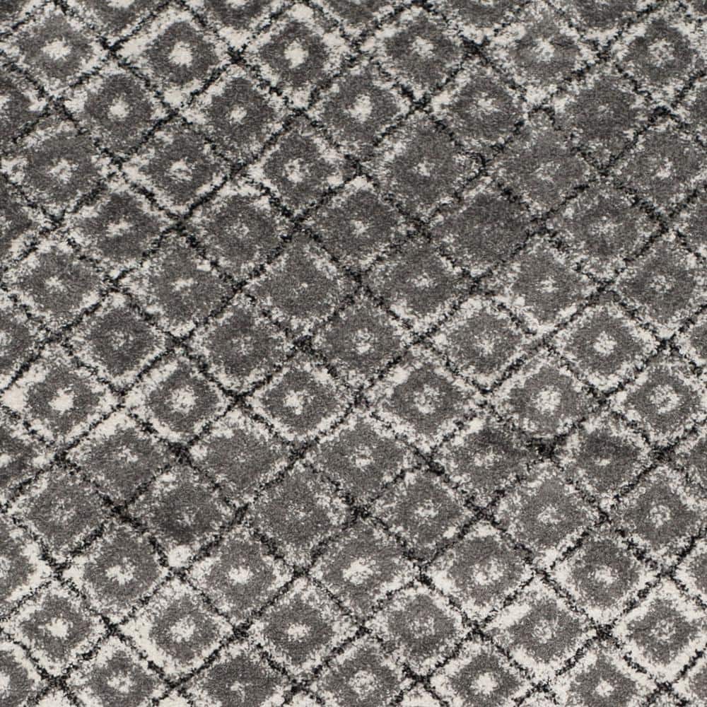 Ivory and Silver Geometric 9' x 12' Synthetic Area Rug