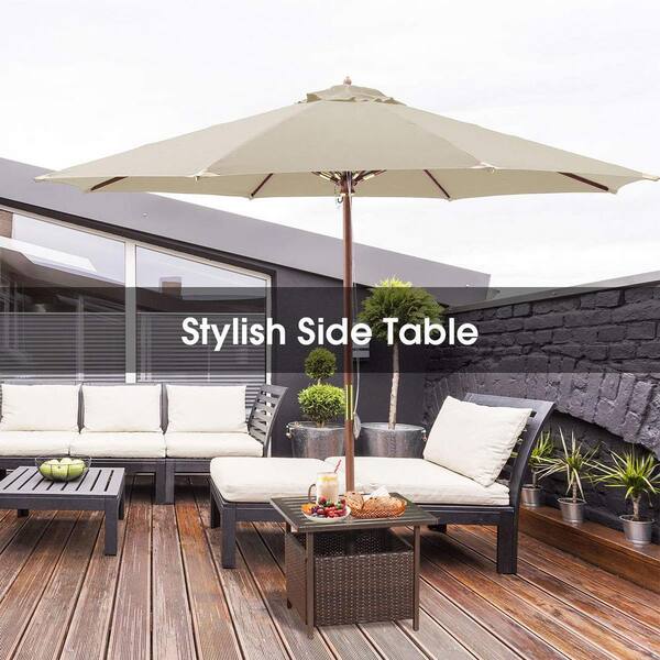 brown wicker outdoor side table with umbrella hole