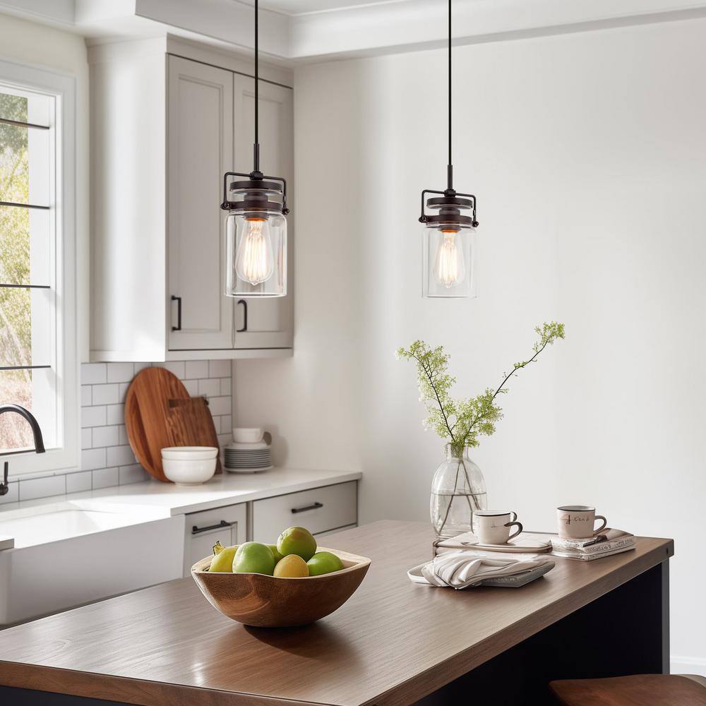 Wyer 8" Bronze Industrial Pendant Light with Clear Glass Shade