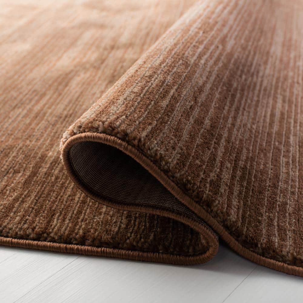 https://images.thdstatic.com/productImages/5edeef0a-db27-4917-82b1-357afdd40599/svn/brown-safavieh-area-rugs-vsn606e-7sq-1f_1000.jpg