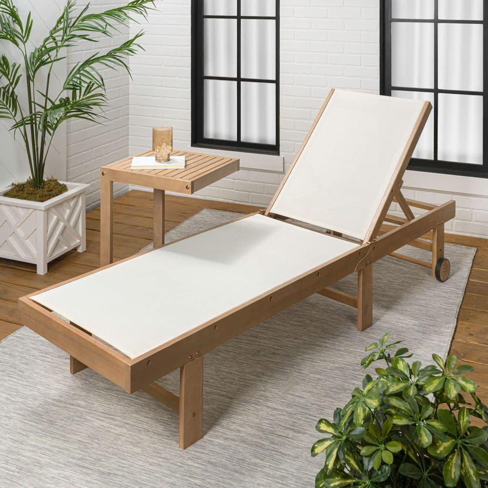 Outdoor foldable chaise lounge set in a room with windows and plants.