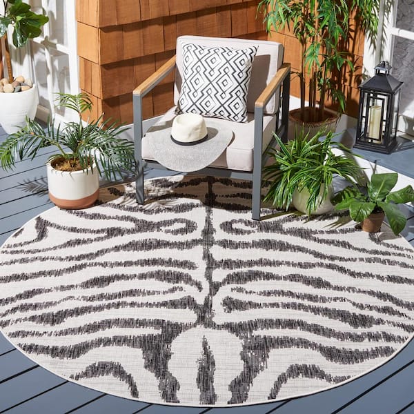 Courtyard Ivory/Black 7 ft. Round Zebra Indoor/Outdoor Area Rug