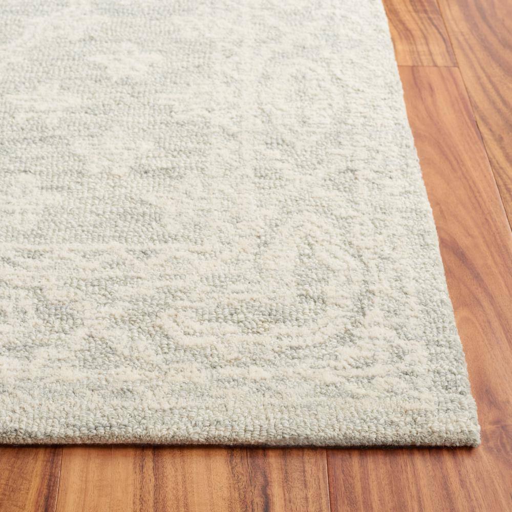 Handmade Light Blue Wool Tufted 6' x 9' Rectangular Rug