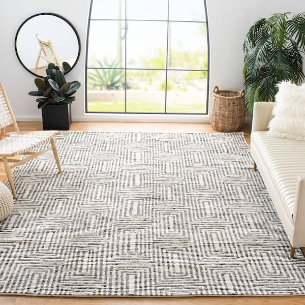 Tibetan 8 ft. x 10 ft. Black/Ivory Geometric Area Rug