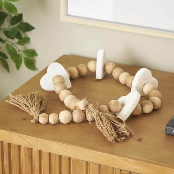 Litton Lane Light Brown Handmade Marble Beaded Heart Garland with Tassel with Knotted Brown Jute and White Accents