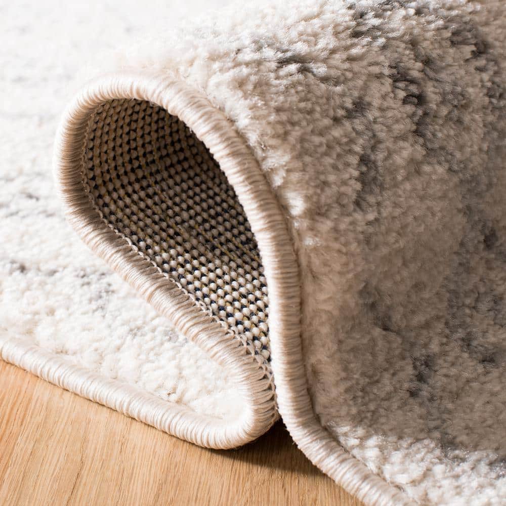 Ivory Geometric Synthetic 2' x 11' Easy-Care Runner Rug