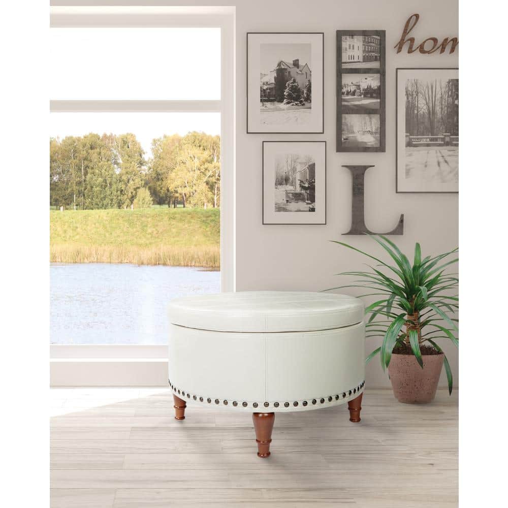 Alloway Cream Faux Leather Round Storage Ottoman with Antique Bronze Nailheads