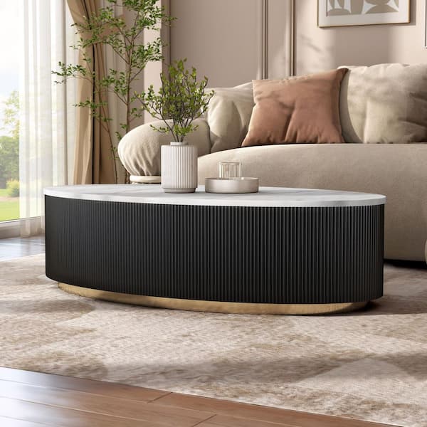 Keith 50 in. Black and White Oval Marble Top Coffee Table with Gold Accent Reeded Plinth Base