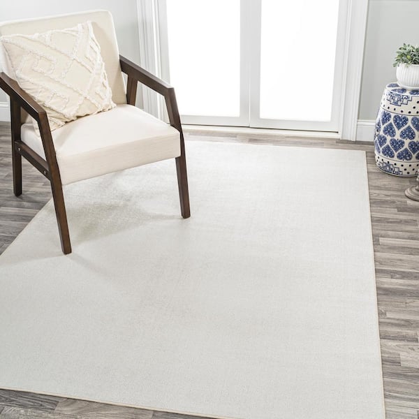 JONATHAN Y Twyla Classic Cream 4 ft. x 6 ft. Solid Low-Pile Machine-Washable Area Rug