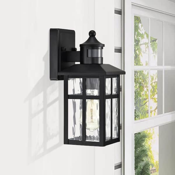 12 in. Matte Black 1-Light Motion Sensing Outdoor Wall Sconce with Dusk to Dawn and Water Wave Glass