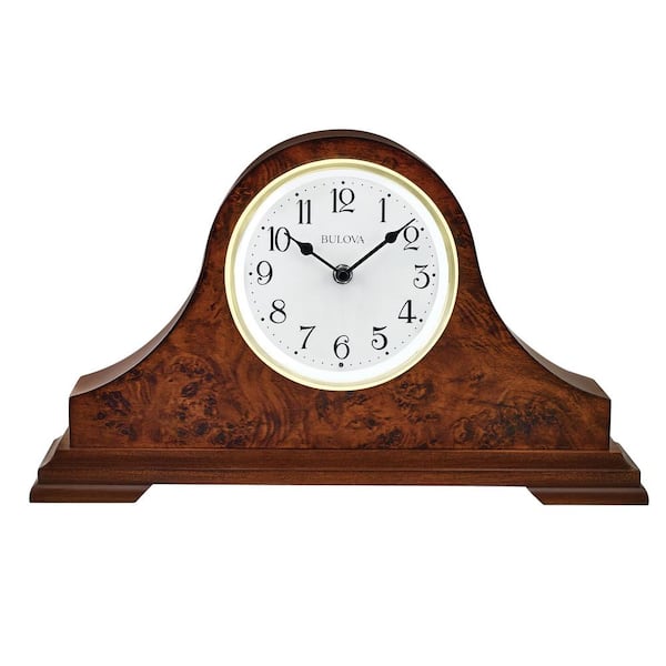 Bulova The Chandler lighted table clock in warm walnut finish a solid wood case. Quartz movement and arabic numerals