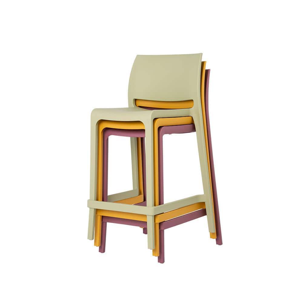 A stack of four counter stools in Wasabi Green, yellow, and red.
