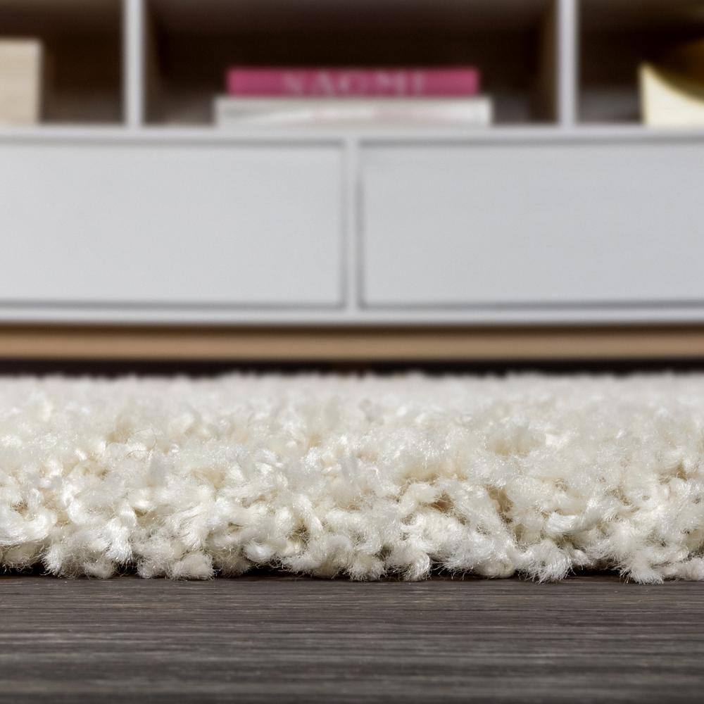 Cream 8' x 10' Reversible Shag Area Rug with Tassels