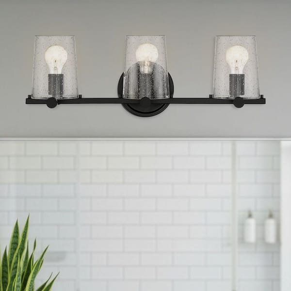 Designers Fountain Matteson 24.75 in. 3-Light Matte Black Industrial Vanity Light with Clear Seedy Glass Shades