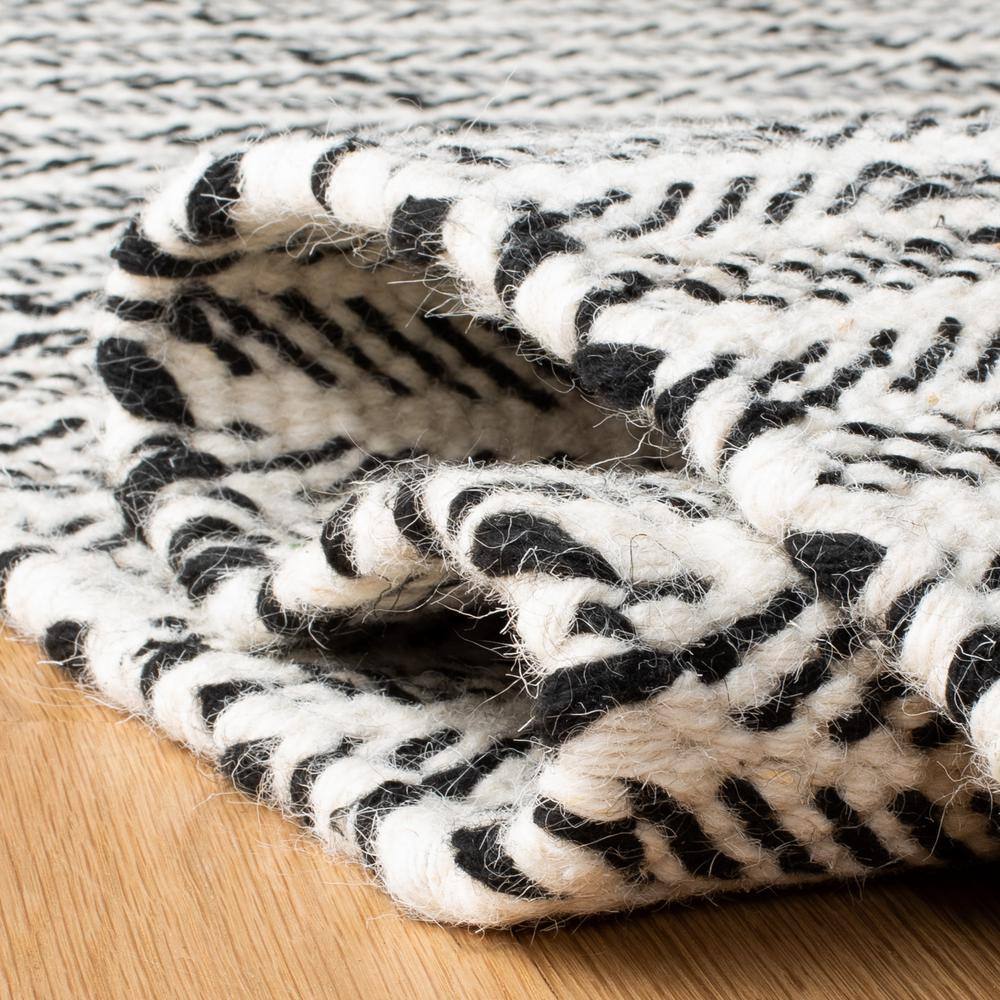Handmade Black and Ivory Wool Tufted Reversible Area Rug, 9' x 12'