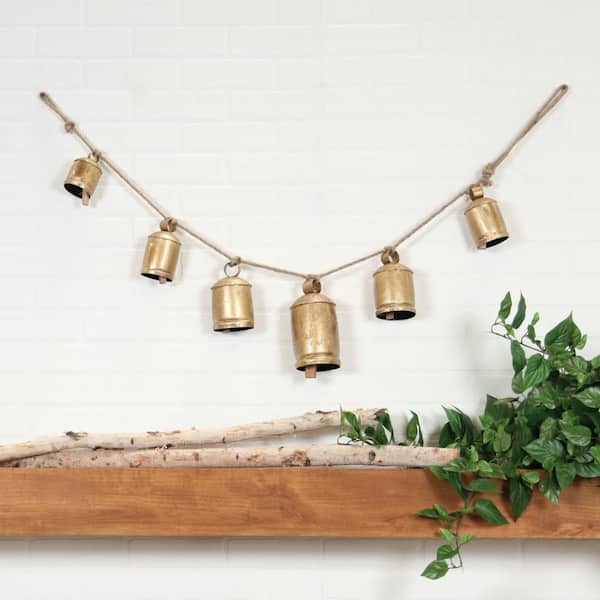 Collection of Hanging Bells. Seventeen Rustic Clay Bells Suspended from  Piece of Wood. Wall Hanging.
