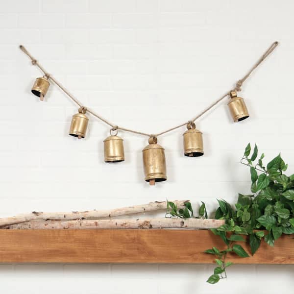 Litton Lane Gold Metal Tibetan Inspired String Hanging Cylindrical Decorative Cow Bells with 6 Bells on Jute Hanging Rope