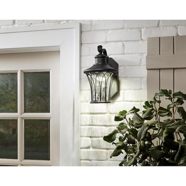 Avia Falls 12.13 in. Black Dusk to Dawn Small LED Outdoor Wall Light Fixture Sconce with Clear Water Glass