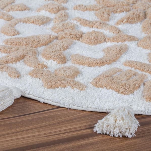 cambridge round tufted bath mat with tassels