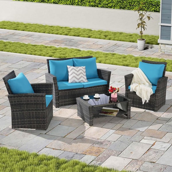 Zeus & Ruta 4-Piece Gray Wicker Outdoor Patio Conversation Set with Light Blue Cushions and Tempered Glass Coffee Table