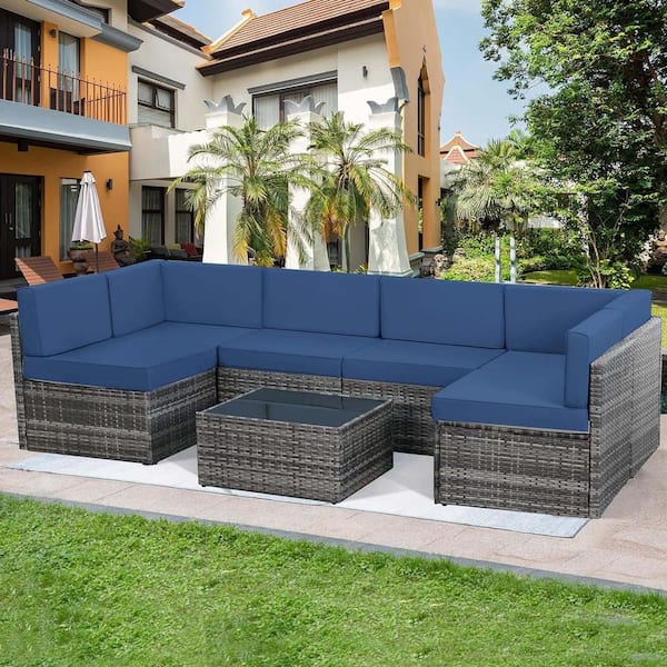 Zeus & Ruta 7-Piece Gray Wicker Outdoor Conversation Set with Dark Blue Cushions, 1-Square Glass Table